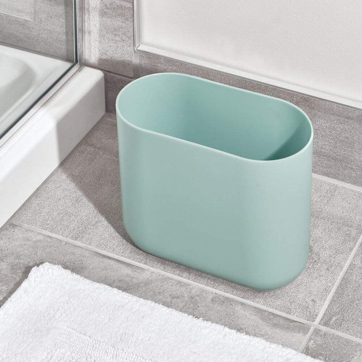 iDesign Cade Oval Slim Trash, Compact Waste Basket Garbage Can for Bathroom, Bedroom, Home Office, Dorm, College-Matte Soft Aqua Pack of 1