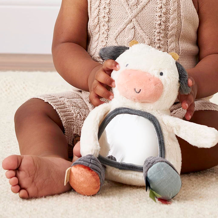 Itzy Ritzy Sensory Tummy Time Toy Mirror - Features Crinkle & Jingle Sounds, Multiple Textures and Mirror for Self-Discovery, Infant Toy for Ages 0 Months and Up, Cow