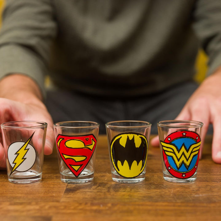 Silver Buffalo DC Comics Superhero Logos Mini Glasses 4 Pack Featuring Flash, Superman, Wonder Woman, and Batman, 1.5 Ounces Comics Sketch Logos