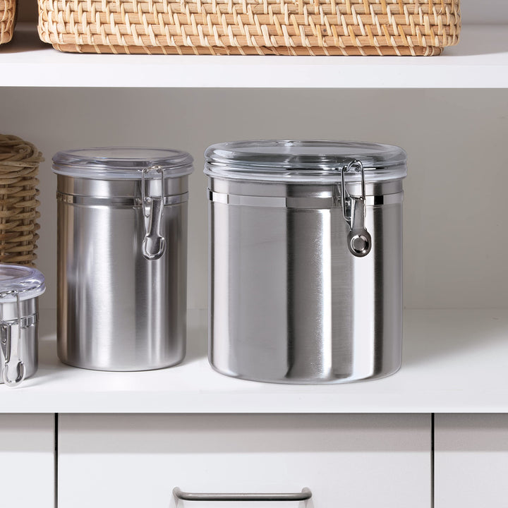 OGGI Stainless Steel Kitchen Canister 52 fl oz - Airtight Clamp Lid, Clear See-Thru Top - Ideal for Kitchen Storage, Food Storage, Pantry Storage. Large Size 5" x 6". 47-ounce Airtight Canister